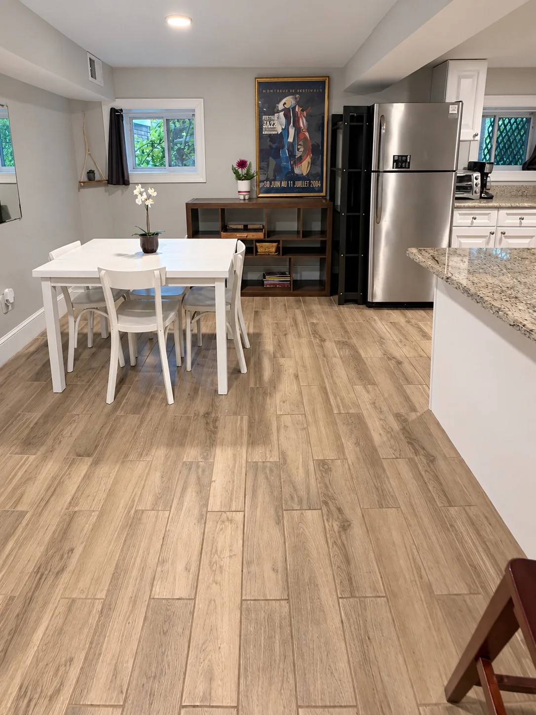Dining table with four chairs next to the kitchen