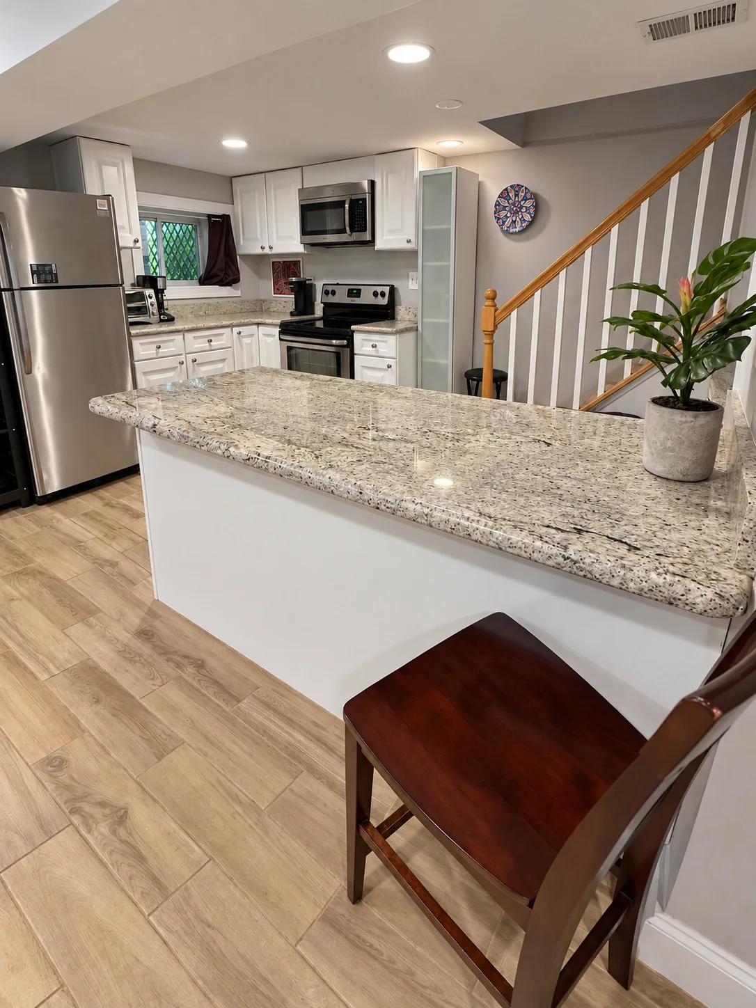 Kitchen breakfast counter and stainless steel appliances
