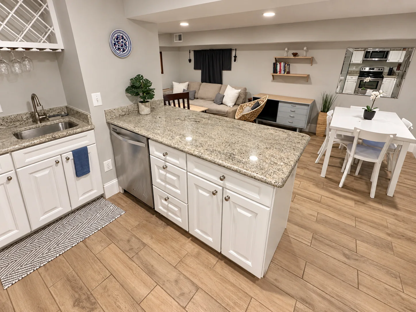 Kitchen island with living and dining areas beyond