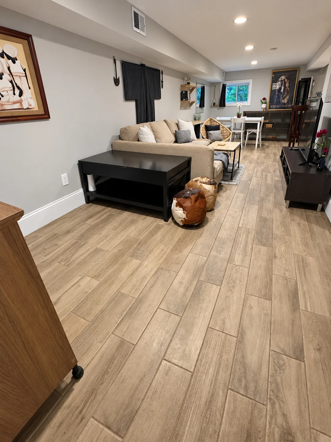 Living room overview with sofa and dining area