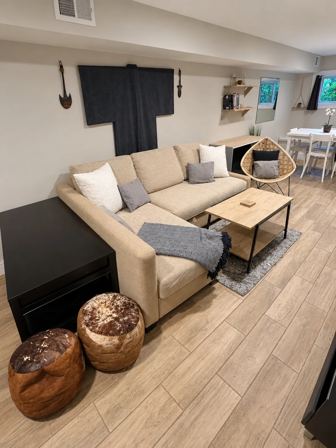 Chaise sectional, coffee table and patterned rug